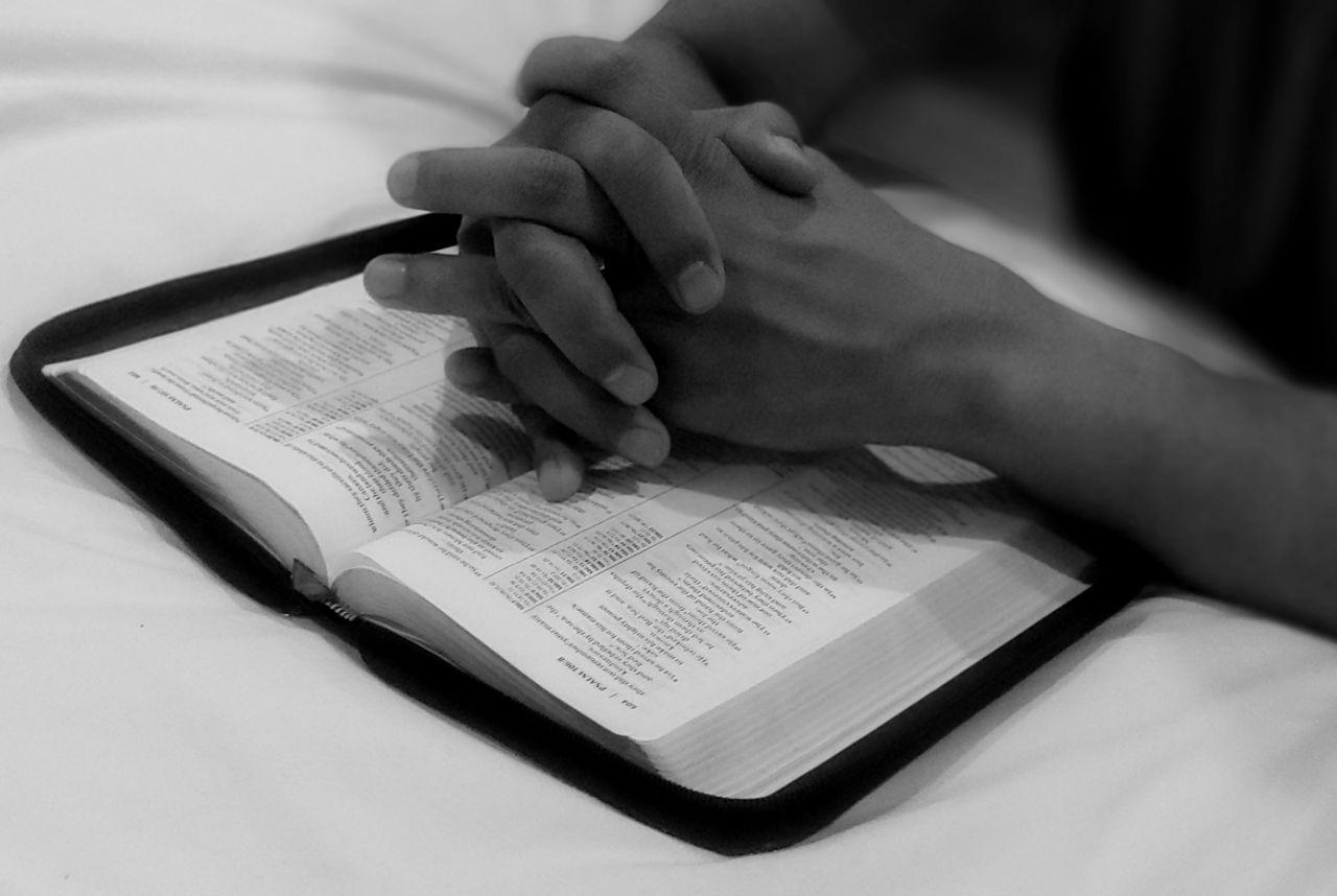 Prayer hands and the Bible